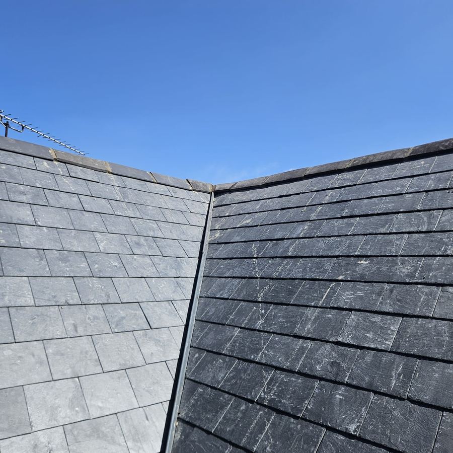 Newly finished slate roof with lead ridge detail