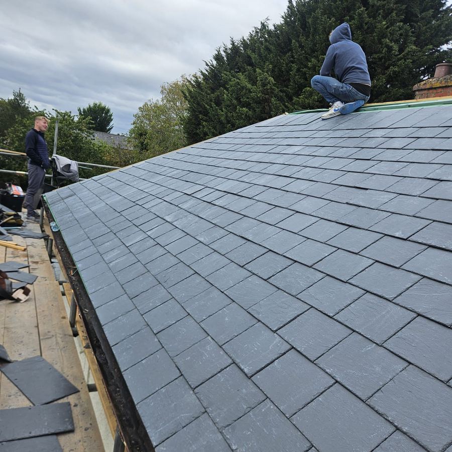 Close up of new slate roof and lead valley work
